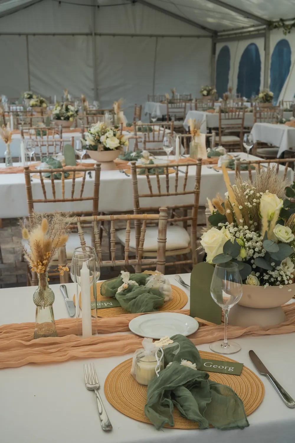 Place setting with charger plate, napkin and candle.