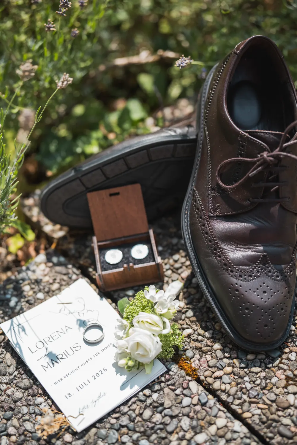 Wedding rings, buttonhole and shoes of the groom.